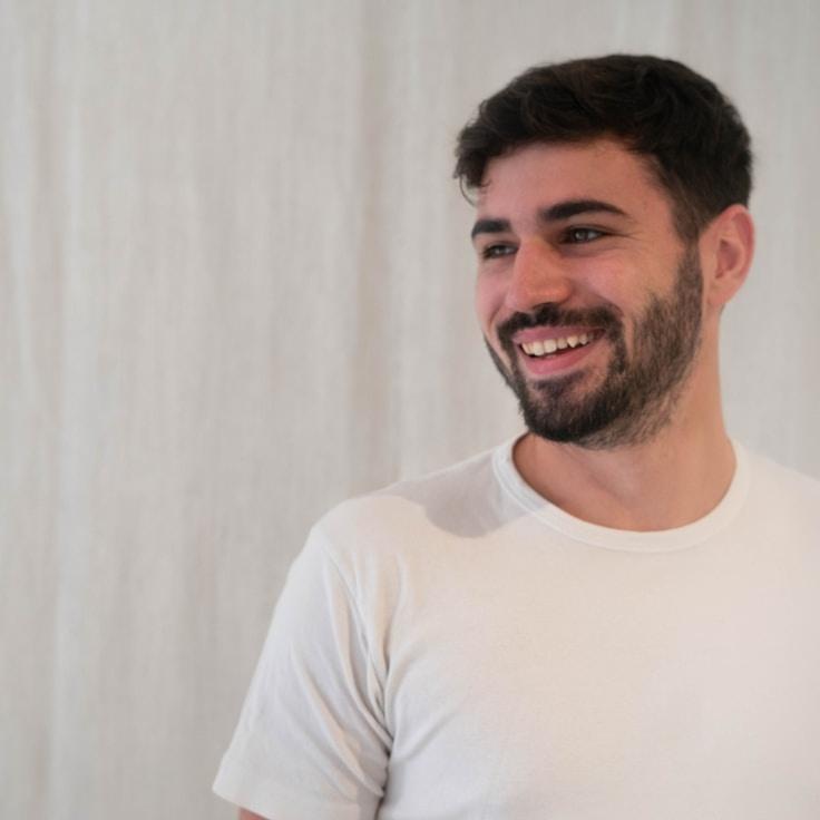 Kaveri Mehta, Lead Design Curator at Studio Leaf Bundle, reviewing corporate floral arrangements